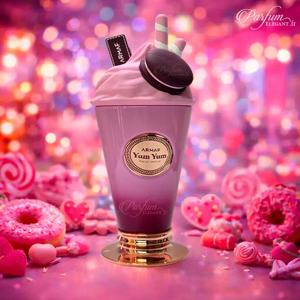 Yum Yum – Eau de Parfum Fruité Gourmand Femme – Armaf 5 Coffret ouvert du parfum Yum Yum Armaf dans un univers gourmand et coloré, mettant en valeur une eau de parfum femme sucrée